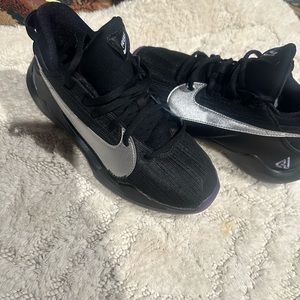 Black and silver Nike Zoom Freaks